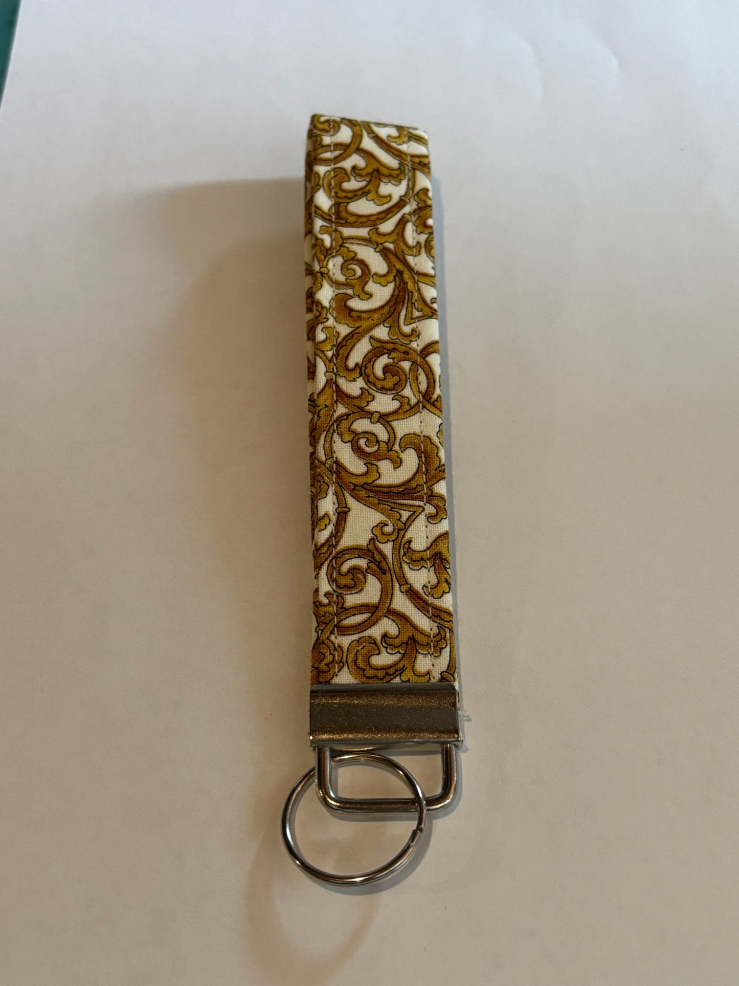 White with gold swirl Wristlet Keychain