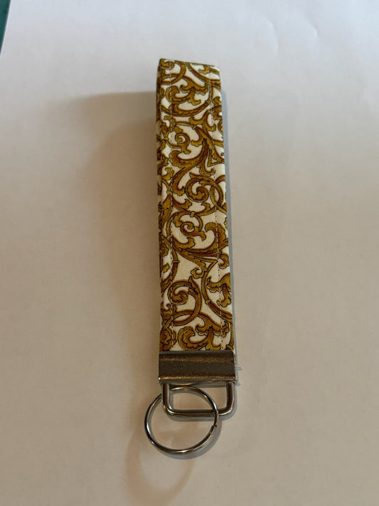 White with gold swirl Wristlet Keychain